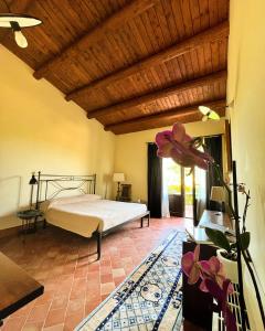 a bedroom with a bed in a room at Oasi di relax in Noto +30 photos