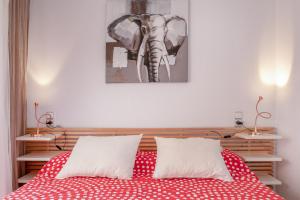a bedroom with an elephant picture on the wall at Luxury flat beach ressort sea view in Arenales del Sol