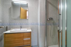a bathroom with a sink and a shower at Luxury flat beach ressort sea view in Arenales del Sol +21 photos