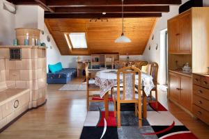 a kitchen with a table and a dining room at Apartmenthaus Fister in Schluchsee