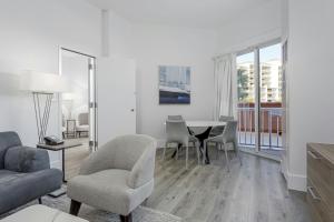 a living room with a table and chairs at Perdido Beach Resort in Orange Beach