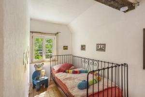 a bedroom with a bed and a window at Haus Berlar in Bestwig
