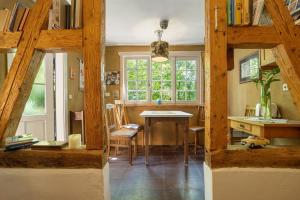 a room with a table and chairs and a window at Haus Berlar in Bestwig