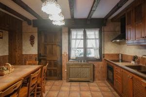 a kitchen with a sink and a counter top at Villa De Urueña Casa de Ilustres in Urueña