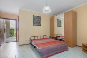 a bedroom with a bed and a mirror at Casa D'Agostino in Aosta