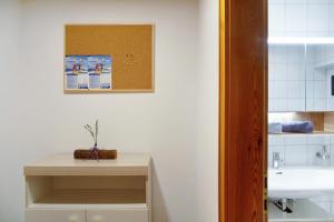 a bathroom with a sink and a counter with a sink at Apart Löffler in Kappl +13 photos
