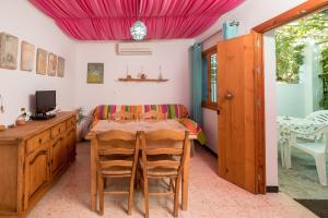 a dining room with a table and chairs at Casa de Gertrudis in El Palmar +21 photos