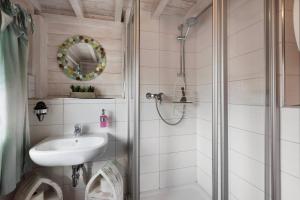 a bathroom with a shower and a sink at Haus Seebrise - Marina Mücheln in Mücheln
