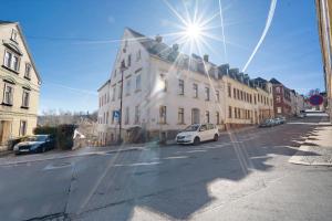 a white car parked in front of a building at Haus Berlin Annaberg in Annaberg-Buchholz