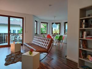 a living room with a couch and a table at Ferienwohnung Panoramablick in Bad Wildbad