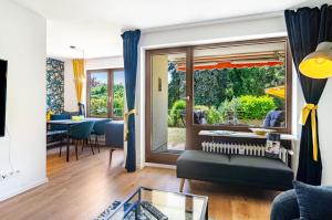 a living room with a couch and a table at Schwabenseenestle in Uhldingen-Mühlhofen