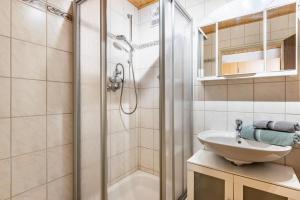 a bathroom with a shower and a sink at Lorenz in Triberg +26 photos