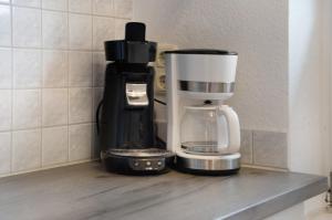 a coffee maker sitting on a shelf in a kitchen at Bäckerhus - Ferienwohnung 3 in Wiek auf Rügen