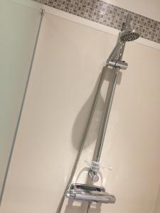 a metal towel rack hanging on a wall at Gästgivars vandrarhem och B&B in Järvsö