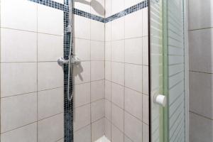 a shower with a glass door in a bathroom at La maison d'à côté in Carpentras +13 photos