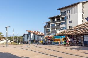 a group of people walking on a street near a building at Location Seignosse Le Penon in Seignosse