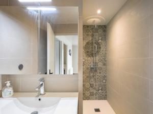 a bathroom with a sink and a shower at Residence les Isards in Formiguères +16 photos