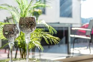 two wine glasses sitting on top of a table at Purer Genuss - Exklusive in Owingen