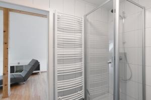 a bathroom with a shower and a glass door at Ferienwohnung am Hirschfelsen in Bühlertal