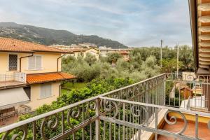 a balcony with a view of a city at Relax in Villa - Versilia in Massa