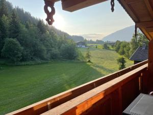 a view of a field from the porch of a cabin at Apartment Bergglück Wildschönau in Wildschönau