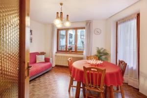 a living room with a table and a couch at A Due Passi Valdidentro in Valdidentro