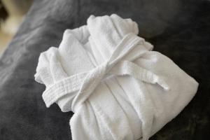 a pile of white towels sitting on a table at Haus Burger Vilpian in Vilpiano +56 photos