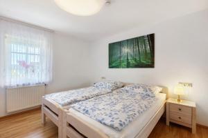 a bedroom with a bed and a tv on the wall at Schweizer Grenze in Waldshut-Tiengen