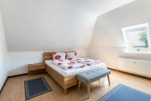 a small bedroom with a bed and a window at Katharina in Westerdeichstrich +22 photos