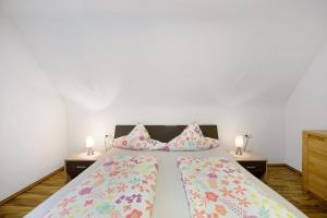a bedroom with a bed with pillows on it at Wasgauaktiv in Schindhard