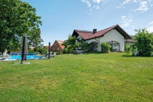 a house with a large yard in front of it at Villa Galerie in Hohenwart