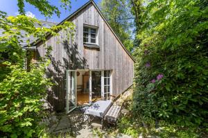 a barn conversion with a patio and a house at Haus Berlar in Bestwig