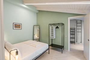 a bedroom with a bed and a mirror at Residenza Borgo Antico Lucia in Ascea