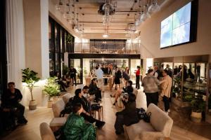 a group of people sitting in the lobby of a store at Mutuo Vive in Guadalajara