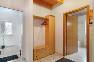a bathroom with a walk in shower and a closet at Ferienwohnungen Böhme in Konstanz +31 photos