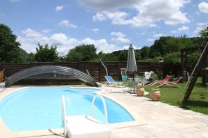 a swimming pool with a metal bridge over it at Gîte Marion in Allemagne-en-Provence
