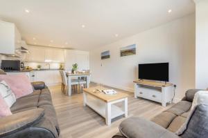 a living room with a couch and a flat screen tv at 2 Bed in Tintagel oc-m37507 in Tintagel