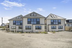 a large white house with a lot of windows at 2 Bed in Tintagel oc-m37507 in Tintagel