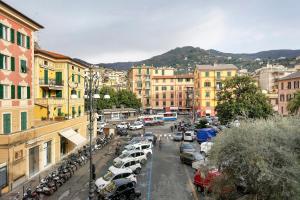 a city with cars parked in a parking lot at Il Mughetto in Rapallo