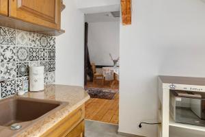 a kitchen with a sink and a counter top at Ferienwohnung Birgit in Dessau