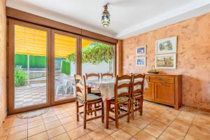 a dining room with a table and chairs at Villa Leonor con piscina privada in Monachil