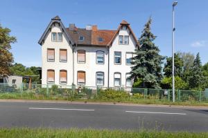 a large white house on the side of a street at Ferienwohnung Birgit in Dessau