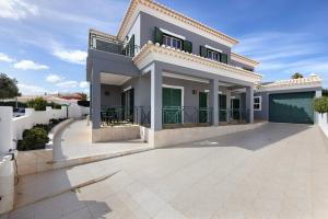 a bedroom villa with a swimming pool at Villa Delphin in Lagos