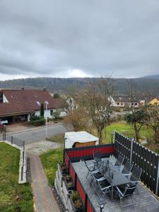 a patio with chairs and a table and a tent at Ferienwohnung Metz in Waldberg