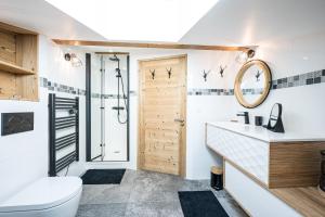 a bathroom with a shower and a toilet and a sink at La scierie de la grande ourse in Albiez-Montrond +83 photos