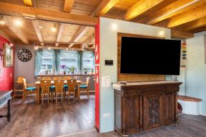 a living room with a large flat screen tv at bei den Holzäppeln in Völkersweiler