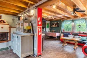 a living room with a stove and a couch at bei den Holzäppeln in Völkersweiler