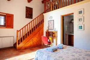 a bedroom with a staircase and a bed in a room at Les Cigales in Ceyreste