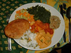 a plate of food with rice and vegetables on a table at La Garnasette in Beaulieu +19 photos