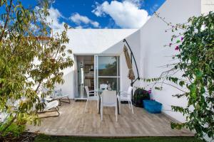a dining room with a table and chairs on a patio at Casa Crater 3 in El Paso